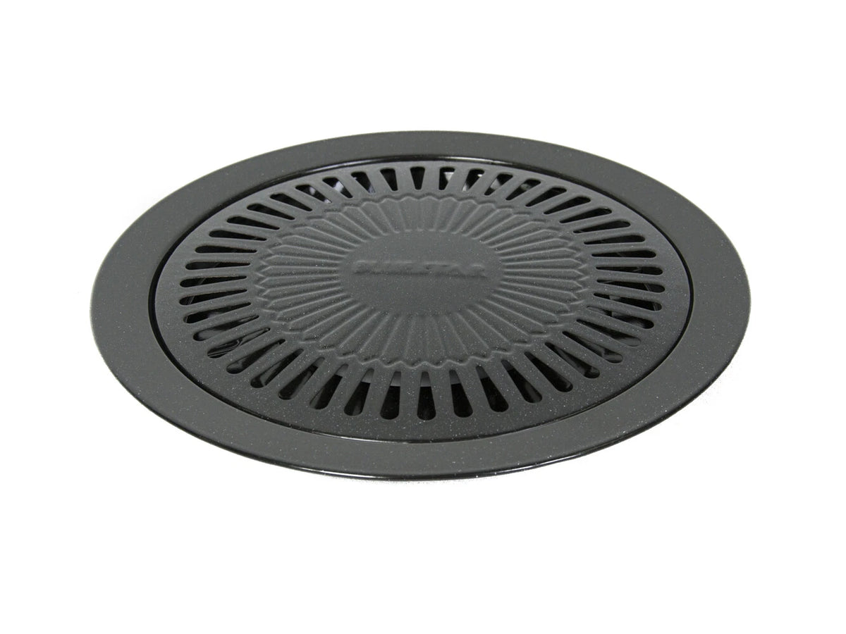 Top view of round non-stick stove top Korean barbecue grill plate with drip groove