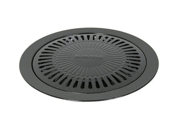 Top view of round non-stick stove top Korean barbecue grill plate with drip groove